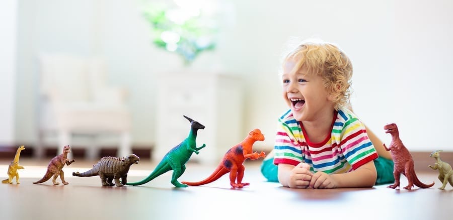 Conscious Parenting Mastery Review: Kid Playing With Dinosaurs